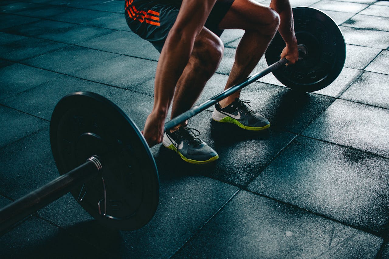 The Art of Drawing Readers In: Your attractive post title goes here Man performing a deadlift exercise in a gym, demonstrating strength and fitness.